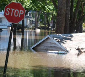 A garage that floated down a street is still submerged in floodwater June 16, 2008 in Cedar Rapids, Iowa. Officials are conducting door to door home inspections before allowing residents in flood affected areas as most of the homes along the Cedar River are no longer structurally sound. (Photo by David Greedy/Getty Images)
